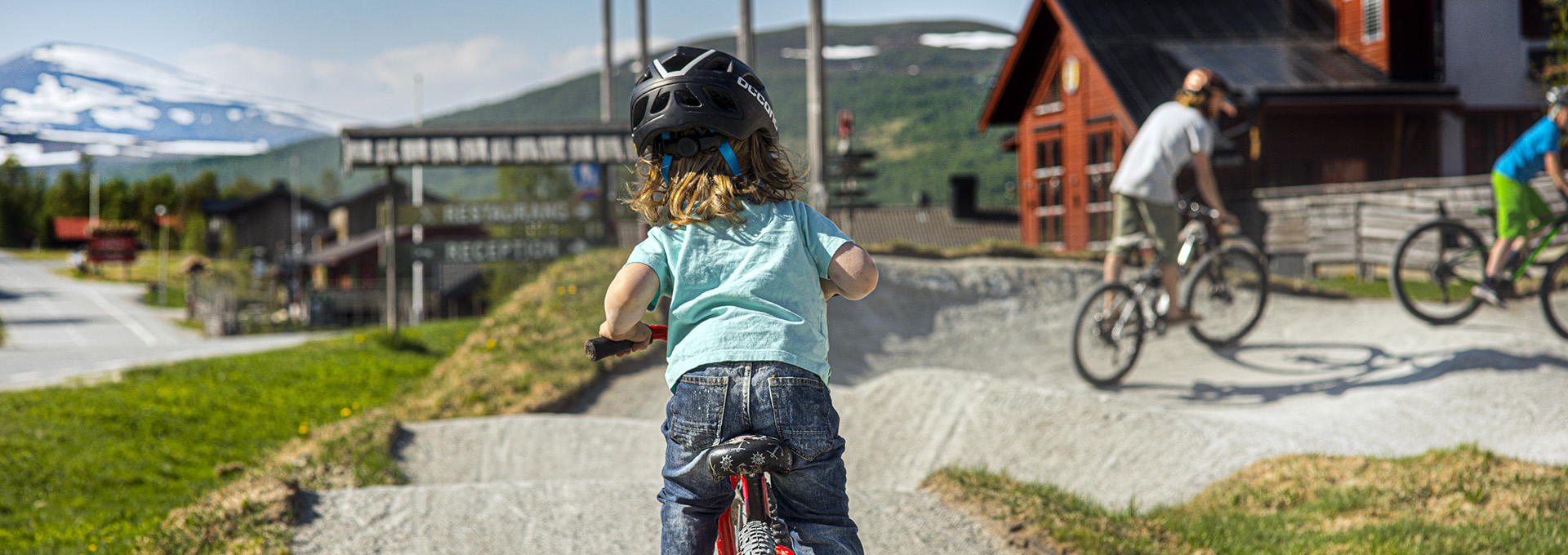children and youths at the pump track in Ramundberget